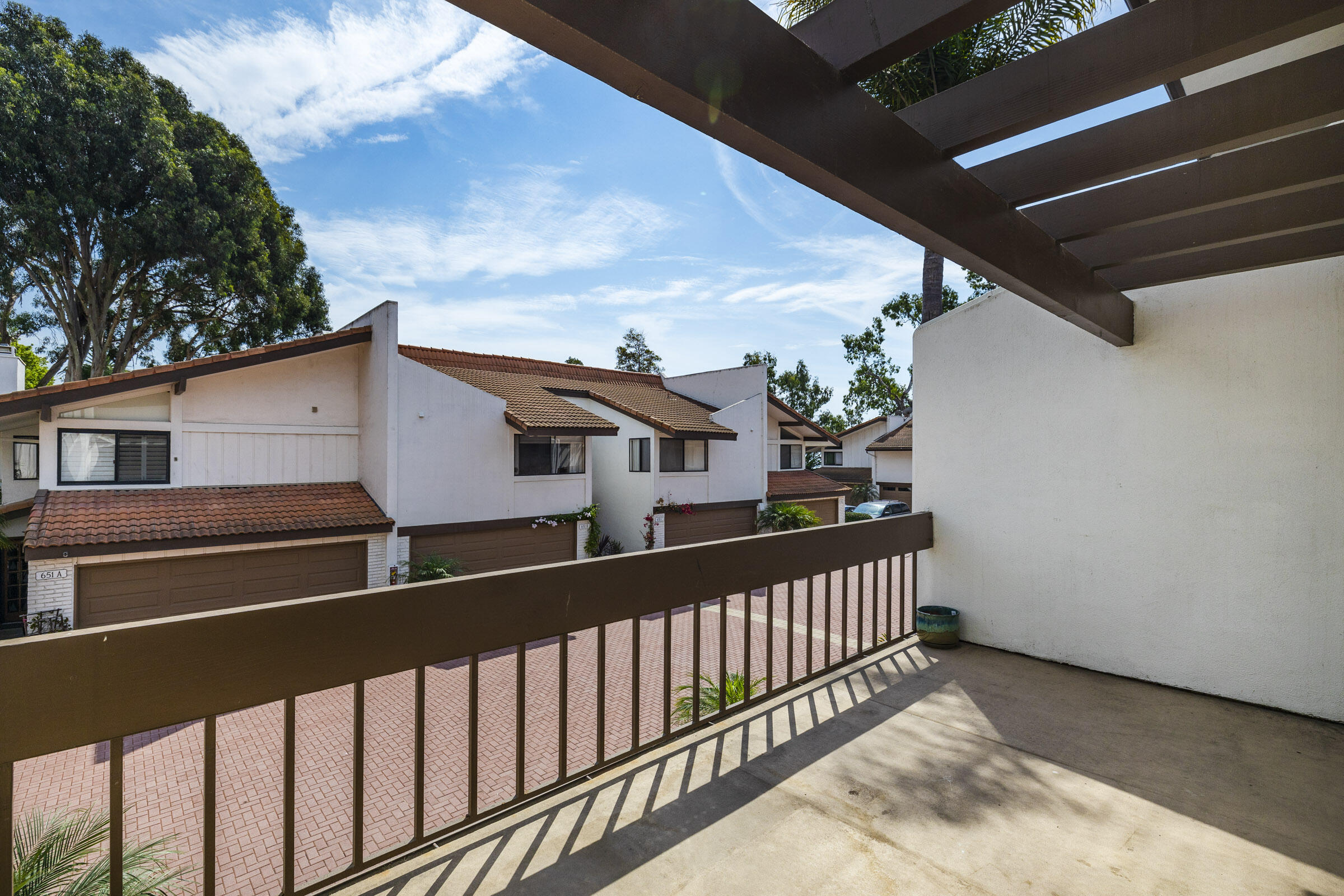 653 Verde Mar Drive, Unit E Santa Barbara, CA 93103 - Photo 12 of 23 a view of a house with wooden fence
