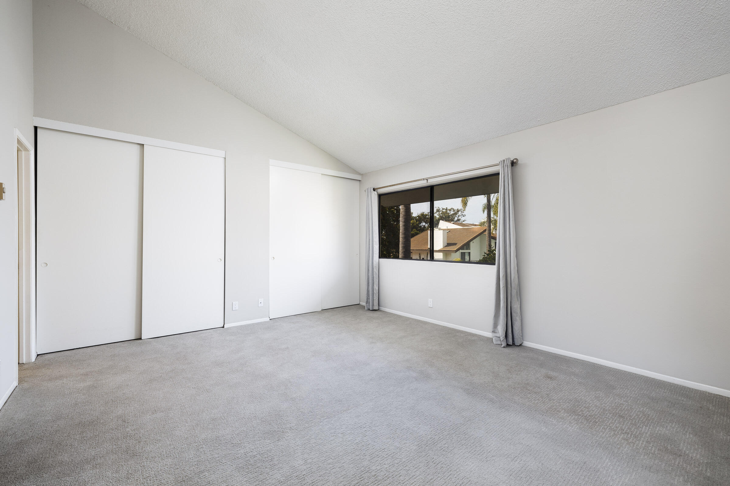 653 Verde Mar Drive, Unit E Santa Barbara, CA 93103 - Photo 13 of 23 an empty room with windows and cabinet