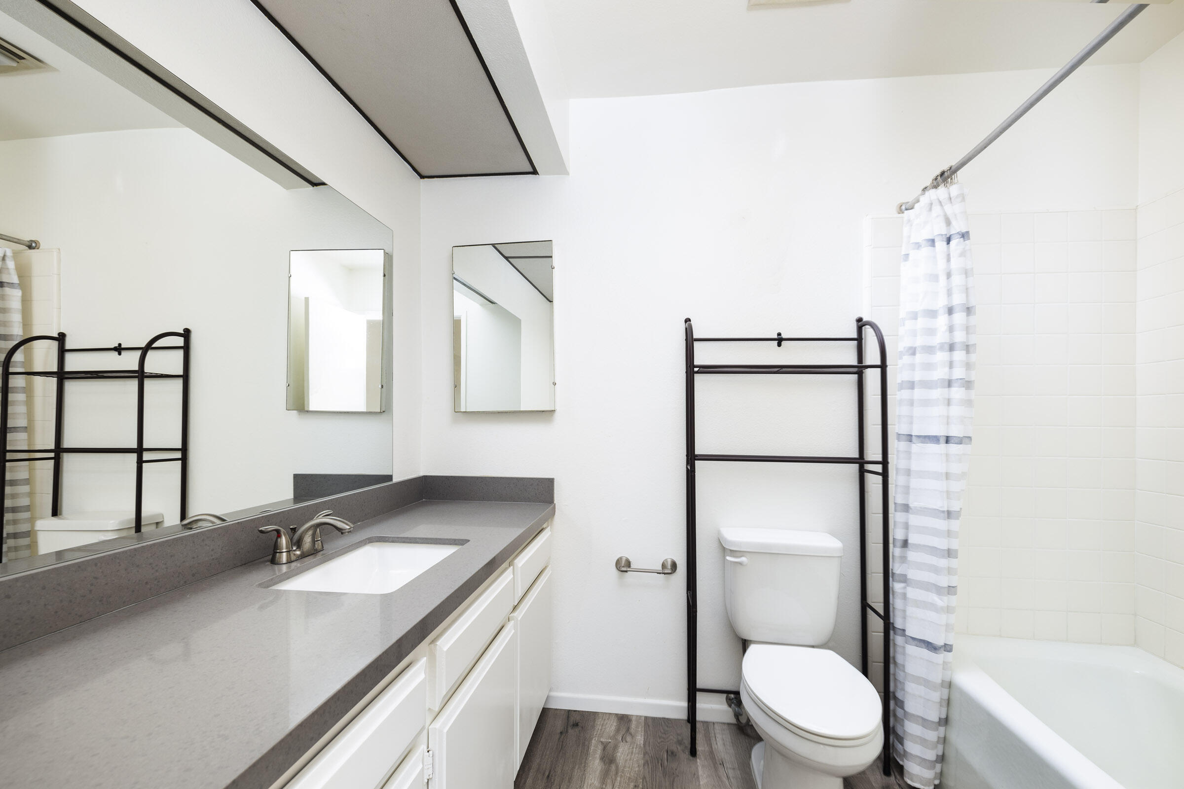 653 Verde Mar Drive, Unit E Santa Barbara, CA 93103 - Photo 18 of 23 a bathroom with a granite countertop sink toilet and shower