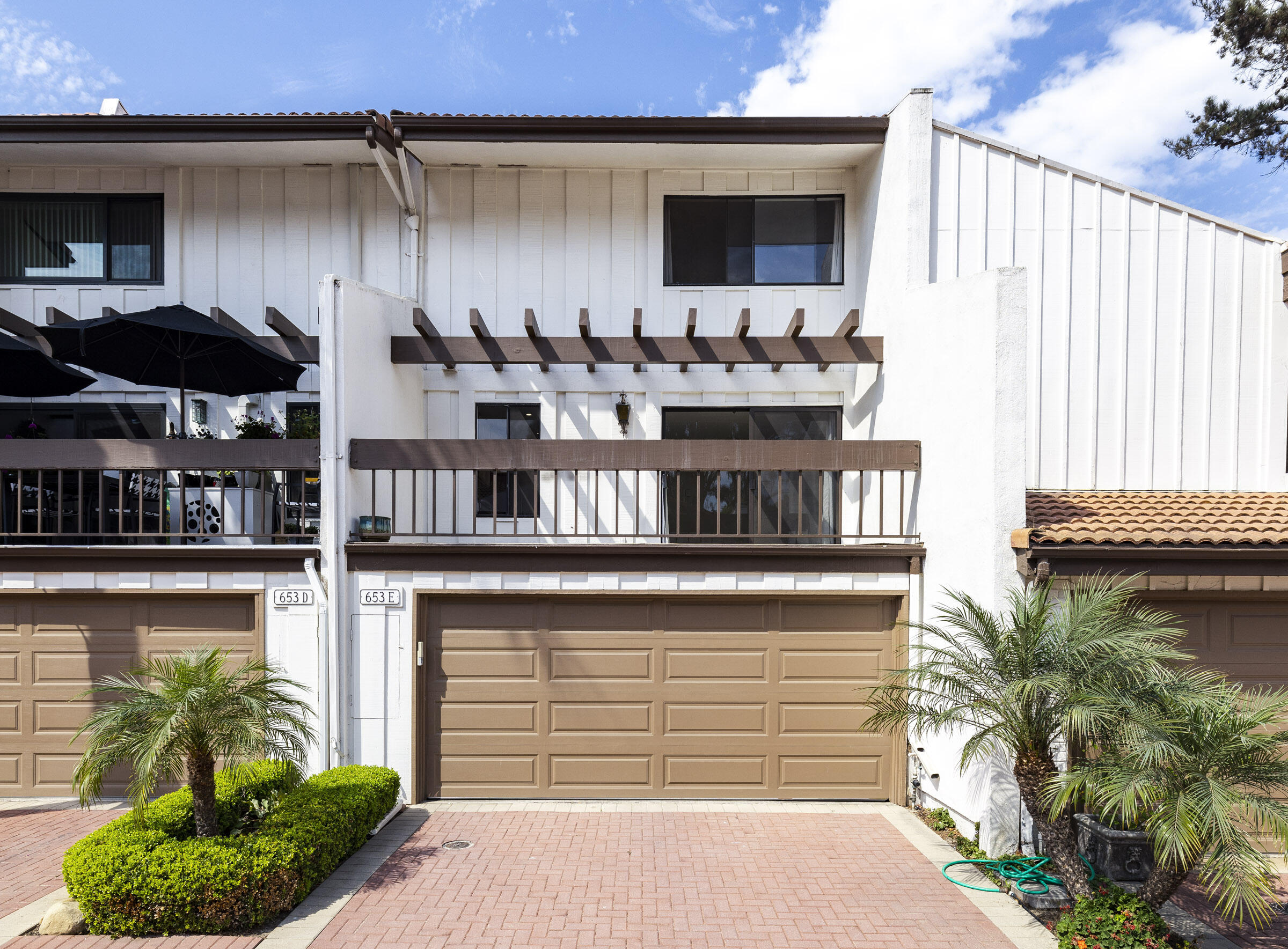 653 Verde Mar Drive, Unit E Santa Barbara, CA 93103 - Photo 20 of 23 a front view of a house with garden