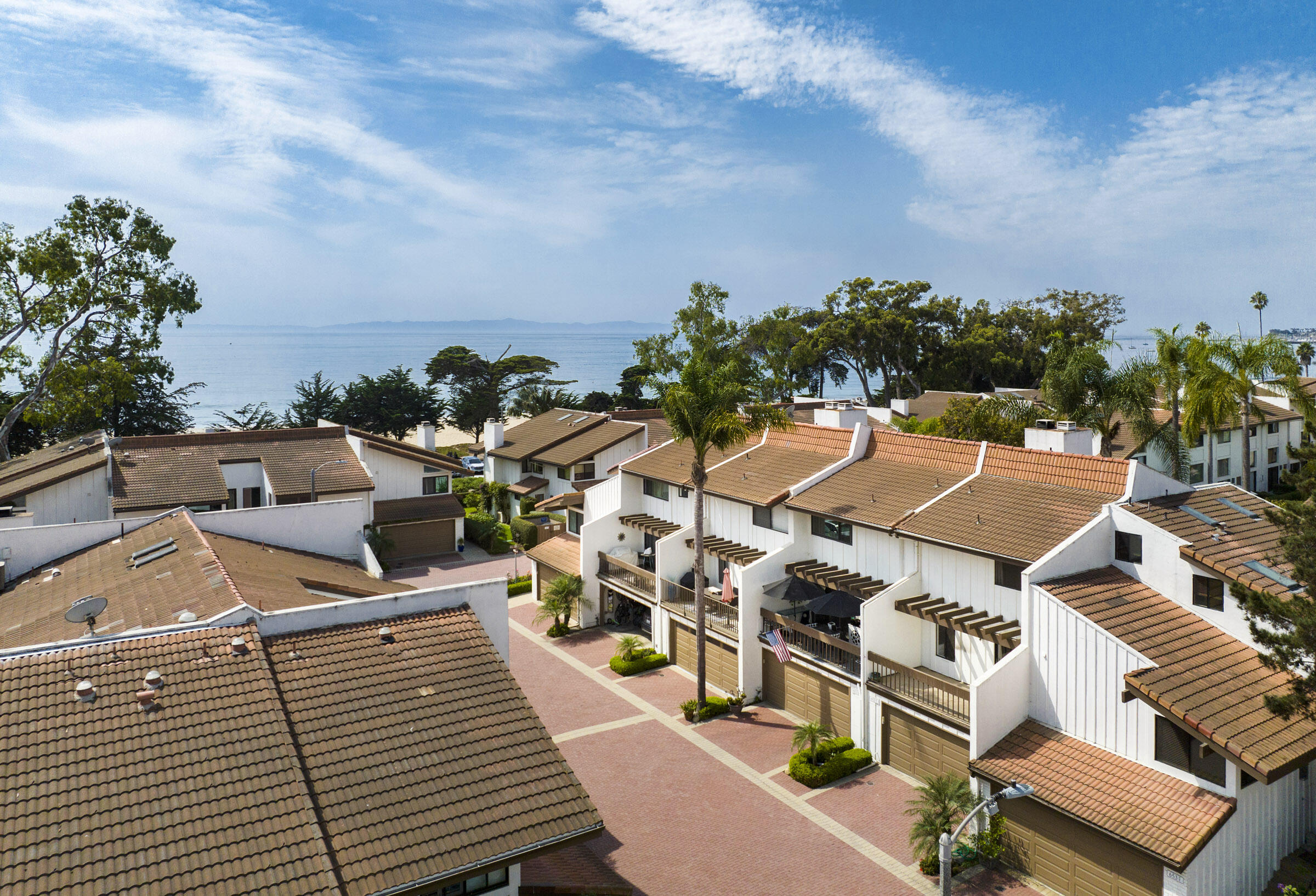 653 Verde Mar Drive, Unit E Santa Barbara, CA 93103 - Photo 3 of 23 an aerial view of a house with swimming pool and large trees