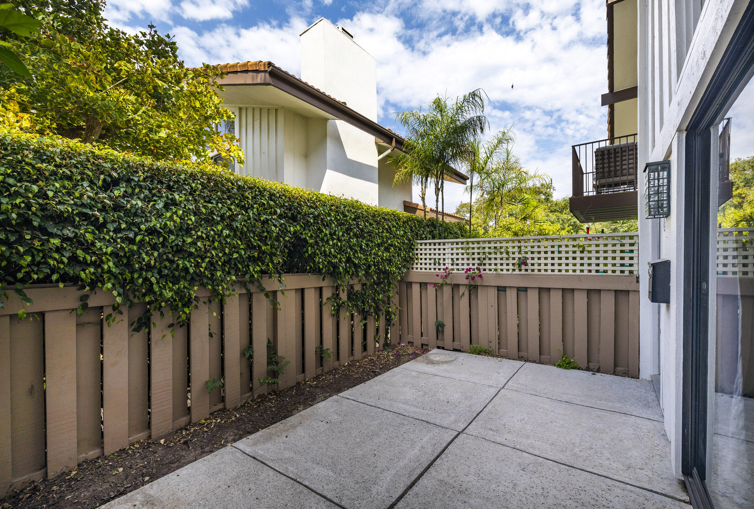 653 Verde Mar Drive, Unit E Santa Barbara, CA 93103 - Photo 4 of 23 a front view of a house with a garden