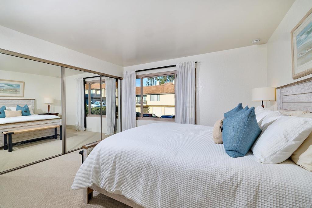 1055 Ficus Lane San Marcos, CA 92069 - Photo 9 of 16 a bedroom with a bed and dresser with mirror