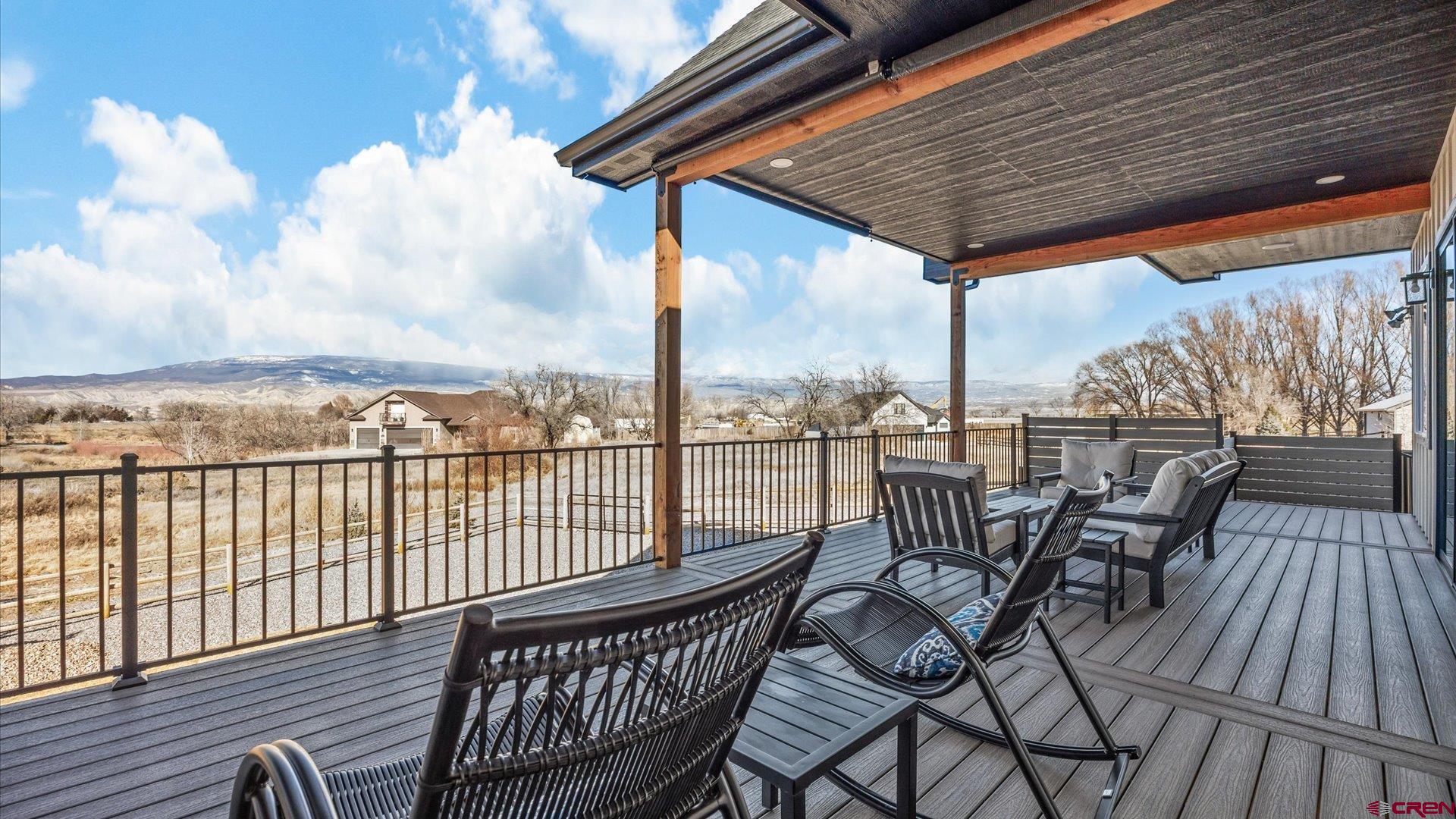 1774 Trapper Court Delta, CO 81416 - Photo 21 of 45 Walk out porch from the main level with trex decking and amazing views.