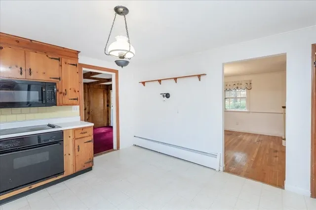 a kitchen with stainless steel appliances granite countertop a stove a refrigerator and a stove