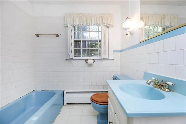 a bathroom with a sink and toilet