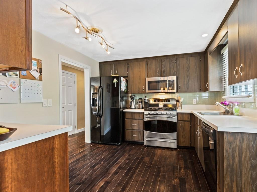 78 Standish Road Needham, MA 02492 - Photo 5 of 16 a kitchen with stainless steel appliances a stove cabinets and wooden floor