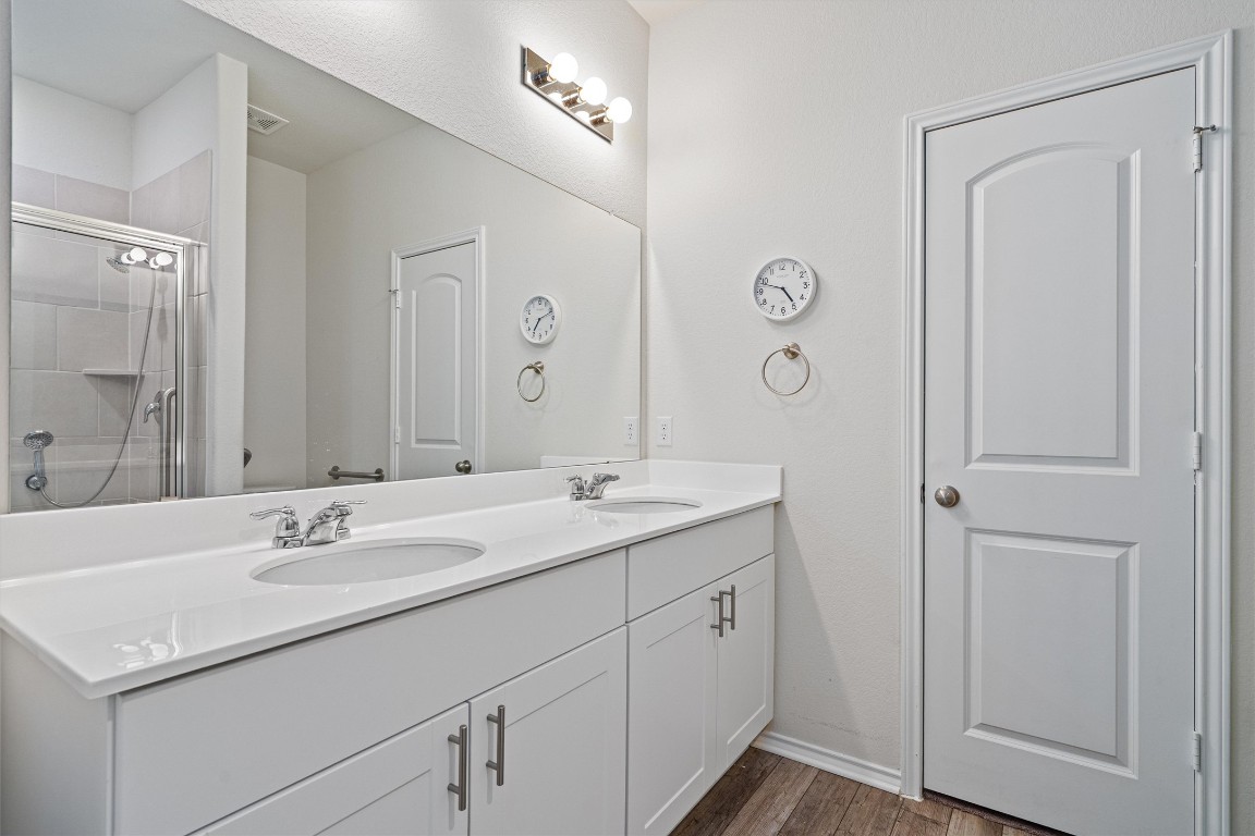 160 Gunther Way Taylor, TX 76574 - Photo 12 of 24 a bathroom with a sink double vanity and a mirror