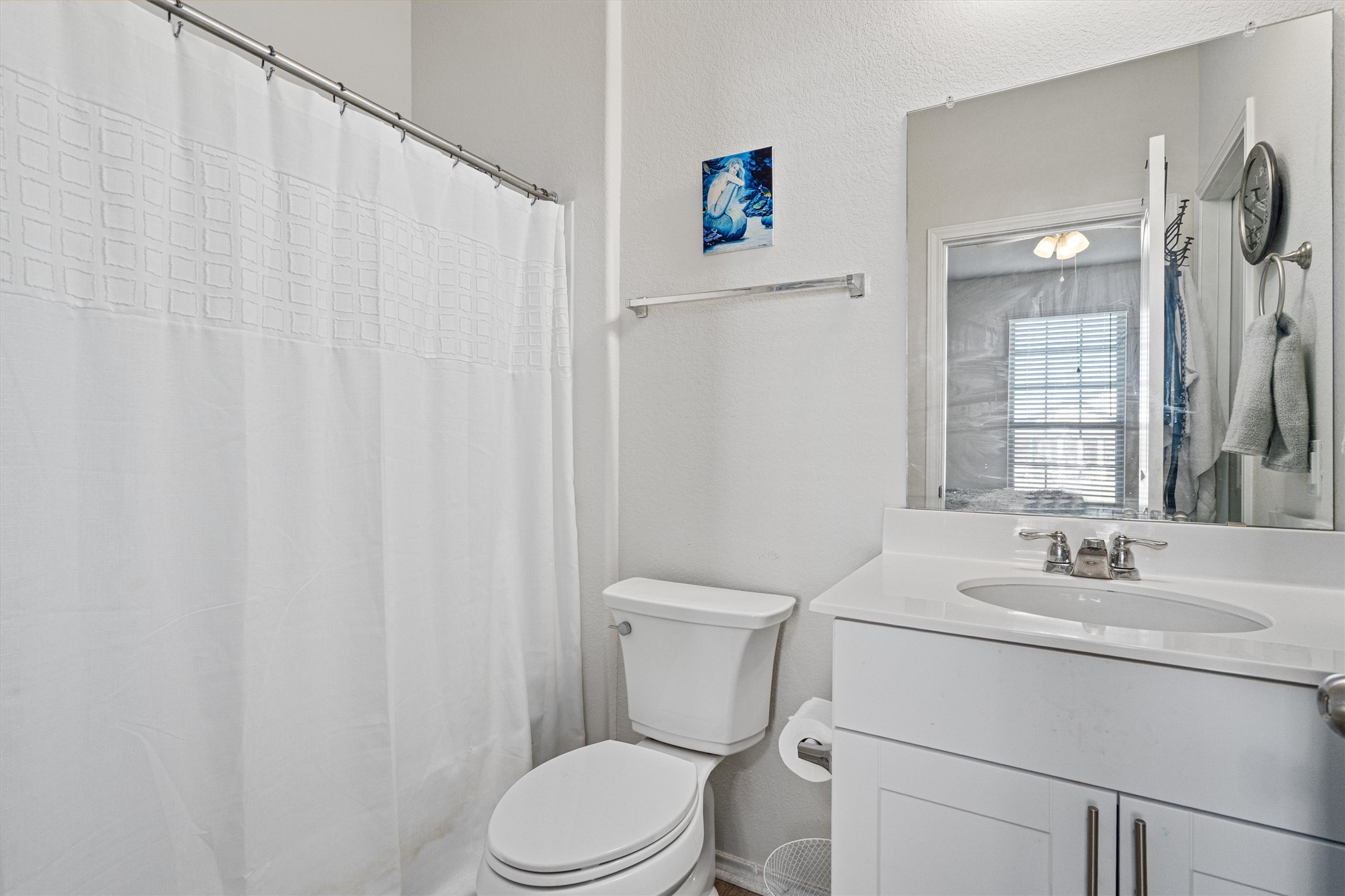 160 Gunther Way Taylor, TX 76574 - Photo 16 of 24 a bathroom with a sink a toilet and shower curtain