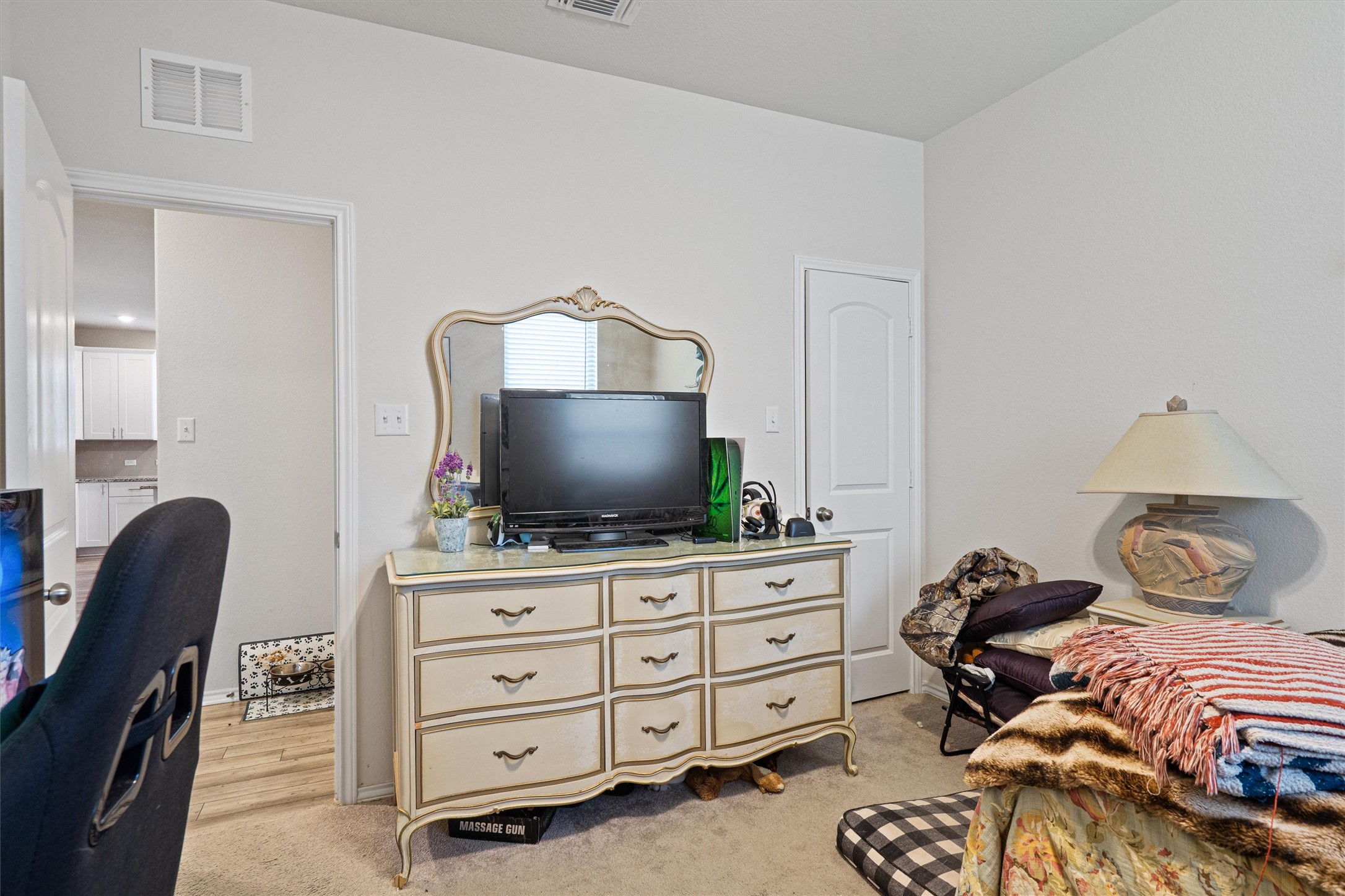 160 Gunther Way Taylor, TX 76574 - Photo 20 of 24 a bedroom with furniture and a flat screen tv