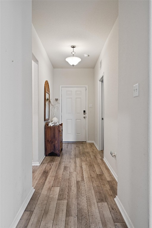 160 Gunther Way Taylor, TX 76574 - Photo 3 of 24 a view of empty room with wooden floor