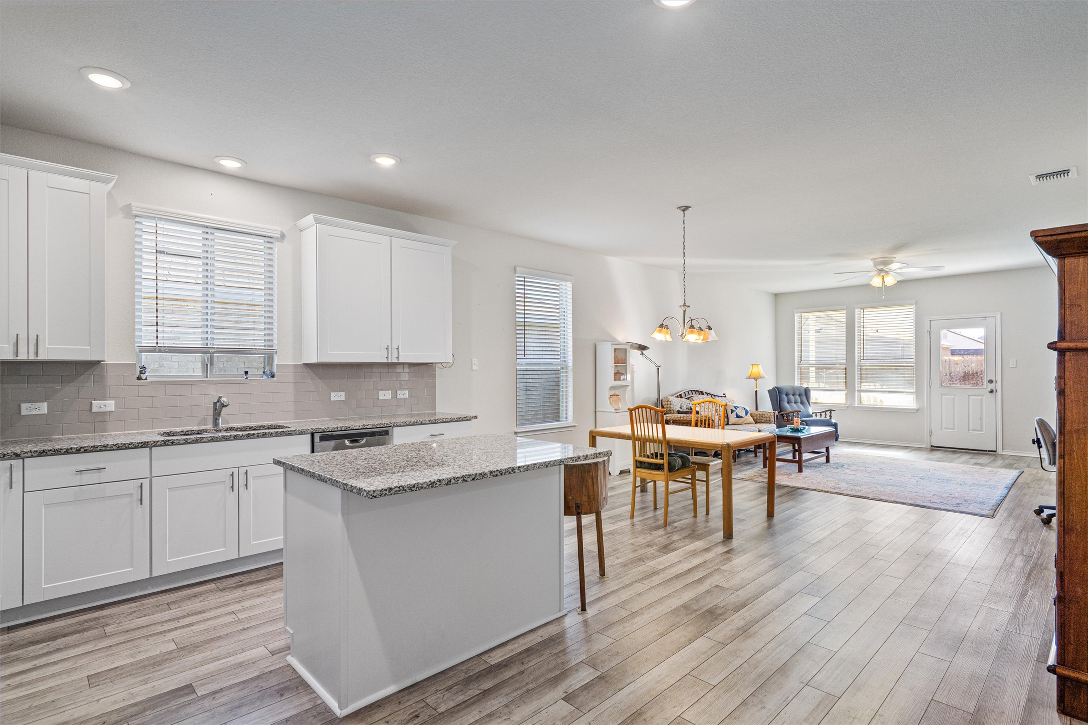 160 Gunther Way Taylor, TX 76574 - Photo 4 of 24 a view of a kitchen and dining room