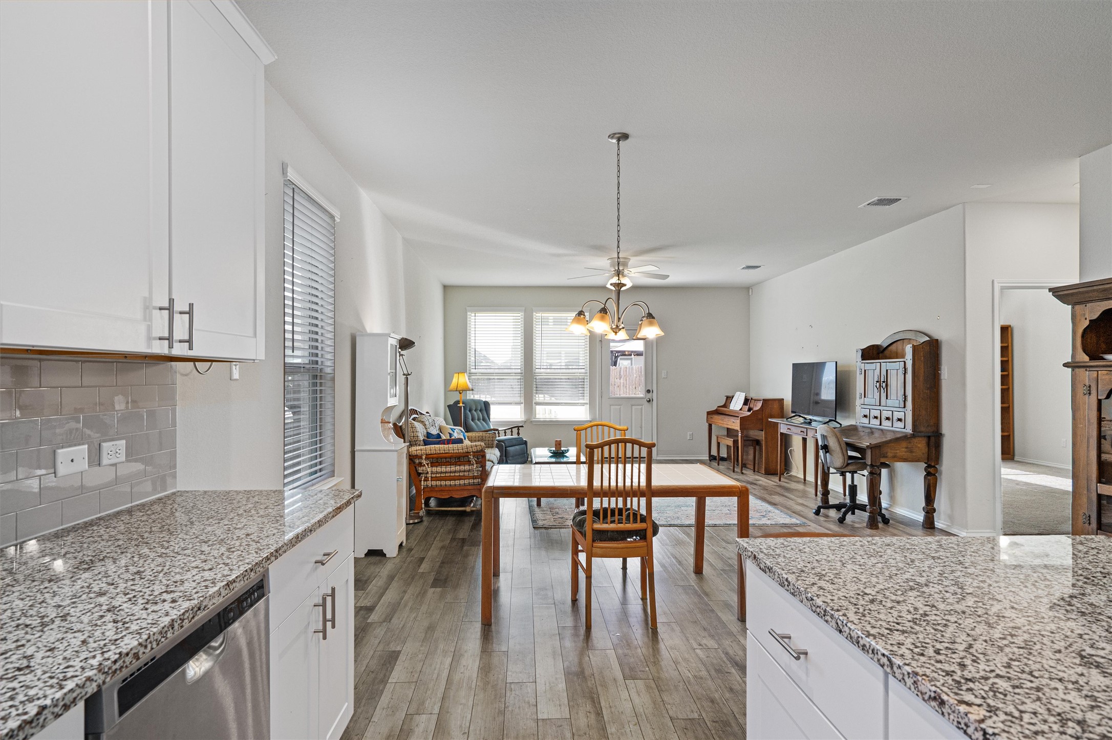160 Gunther Way Taylor, TX 76574 - Photo 7 of 24 a view of a kitchen and dining room
