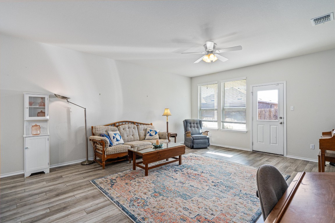 160 Gunther Way Taylor, TX 76574 - Photo 10 of 24 a living room with furniture or couch and a table