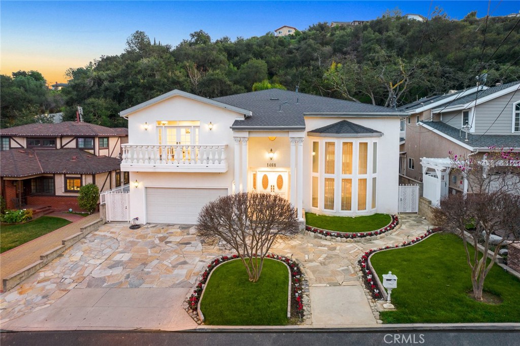 a front view of a house with garden