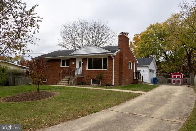 a kitchen with granite countertop a stove and a sink