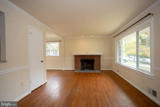 a bathroom with a sink mirror and toilet