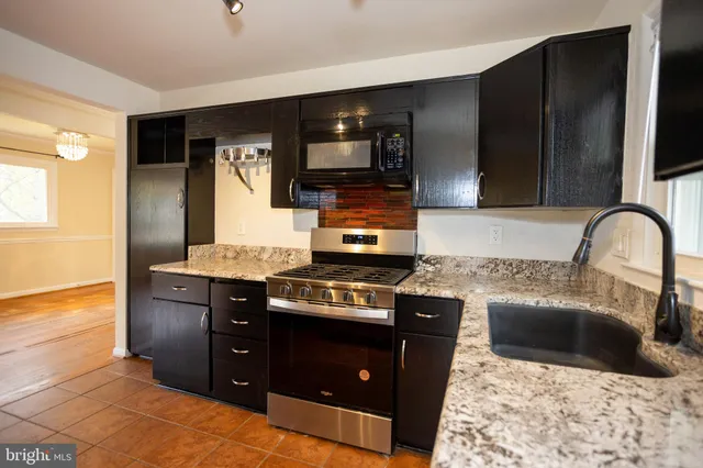 a view of an empty room and wooden floor