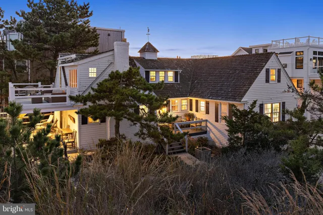 an aerial view of a house with a lake view