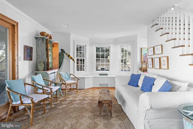 a bedroom with a large bed and a large window