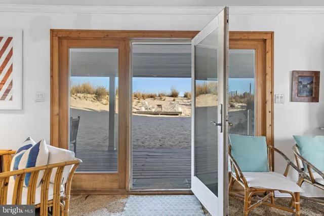 a bedroom with furniture and a flat screen tv