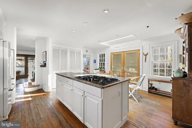 a bedroom with two beds and a window