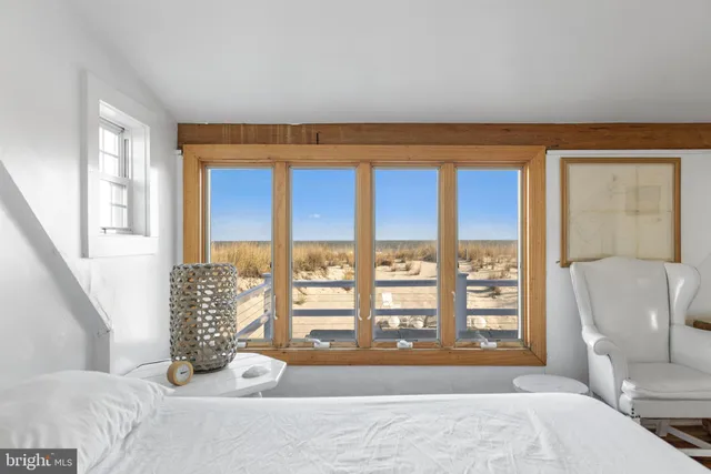 a view of balcony with wooden floor and seating space