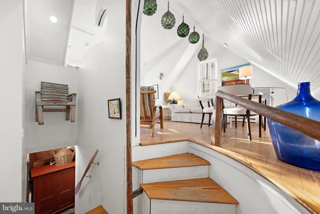 a view of a patio with a table and chairs under an umbrella