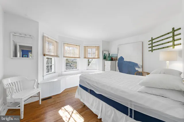 an aerial view of a house with a yard and mountain view