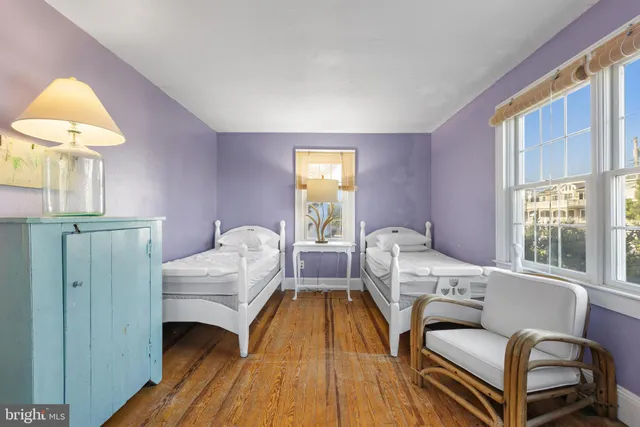 a view of a house with a yard and lake view