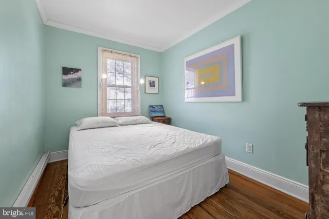 an aerial view of multiple houses with a yard