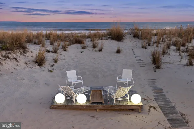 a living room with furniture a fireplace and a window