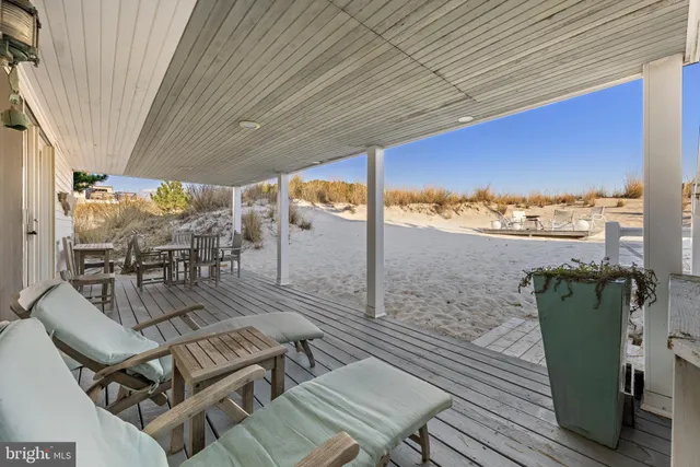 a bathroom with a glass door shower and a sink