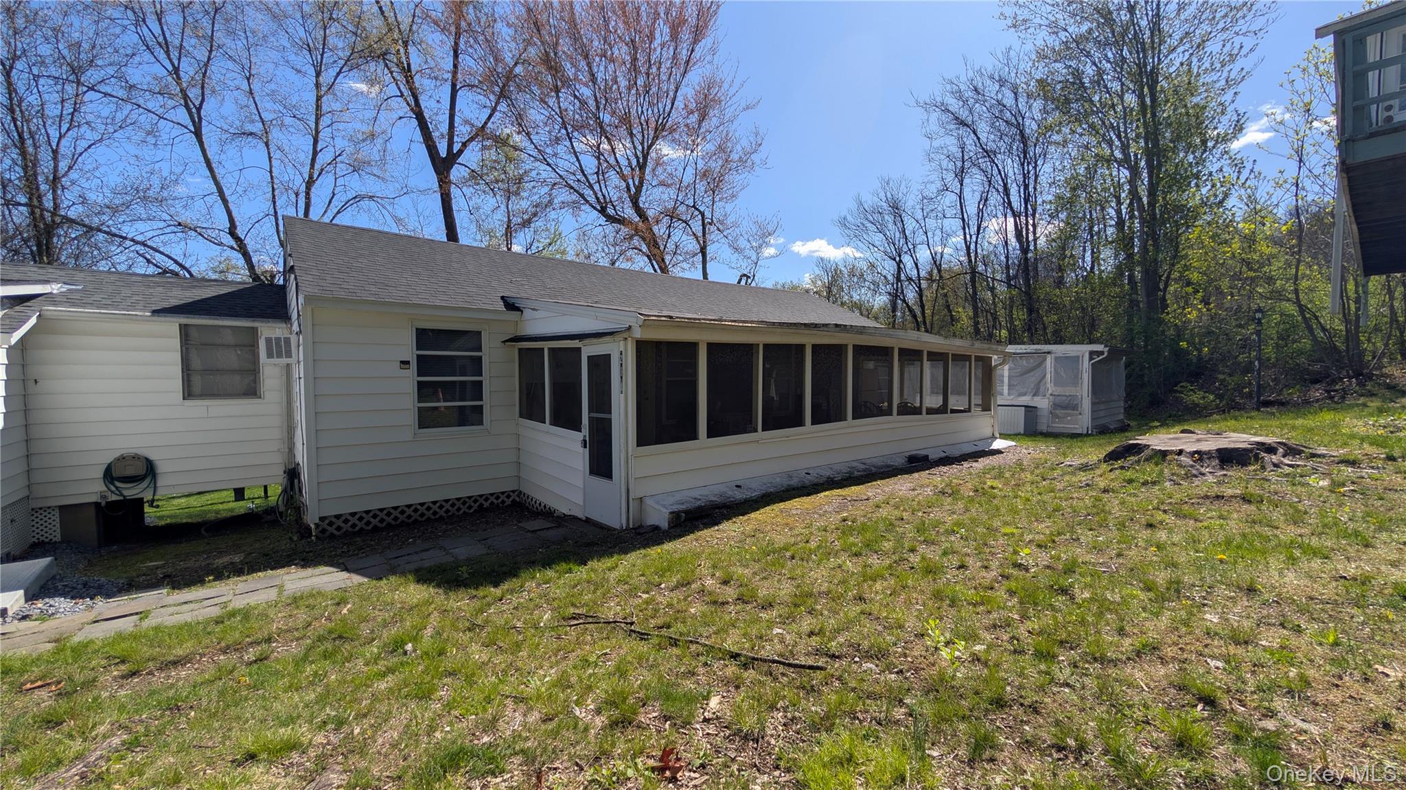 a view of a house with a yard