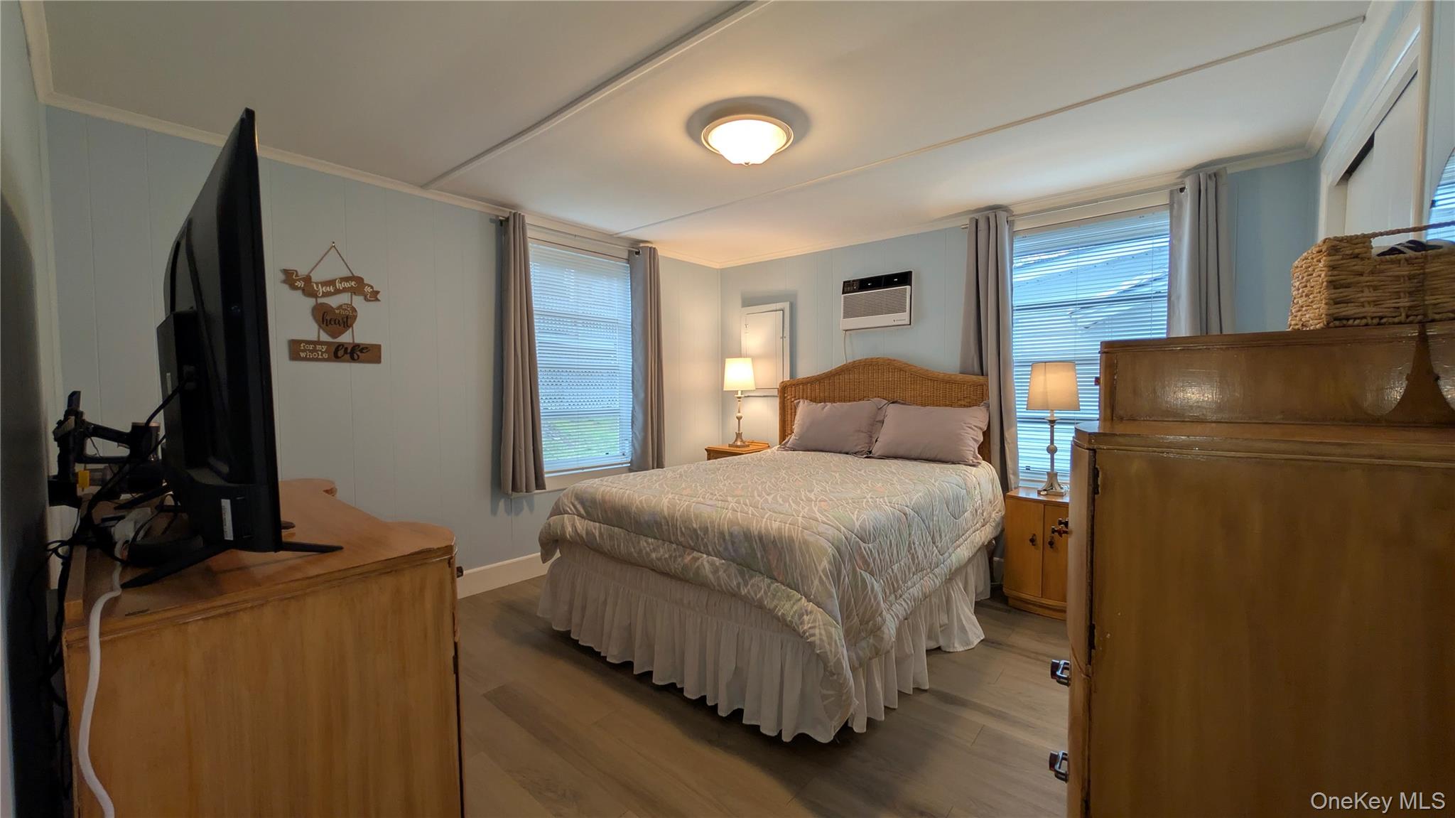 191 Sylvan Lake Road, Unit 28A Hopewell Junction, NY 12533 - Photo 13 of 38 a bedroom with a bed and a flat tv screen on dresser