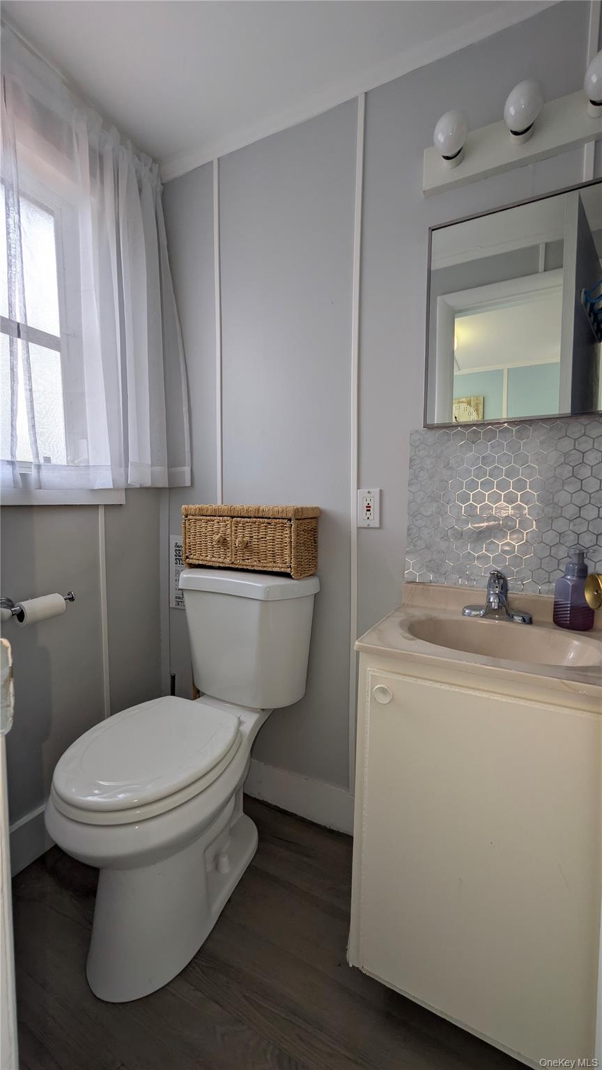 191 Sylvan Lake Road, Unit 28A Hopewell Junction, NY 12533 - Photo 16 of 38 a bathroom with a toilet sink and mirror