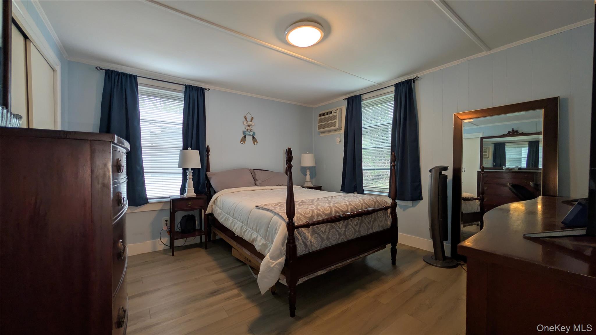 191 Sylvan Lake Road, Unit 28A Hopewell Junction, NY 12533 - Photo 18 of 38 a bedroom with a bed window and a mirror