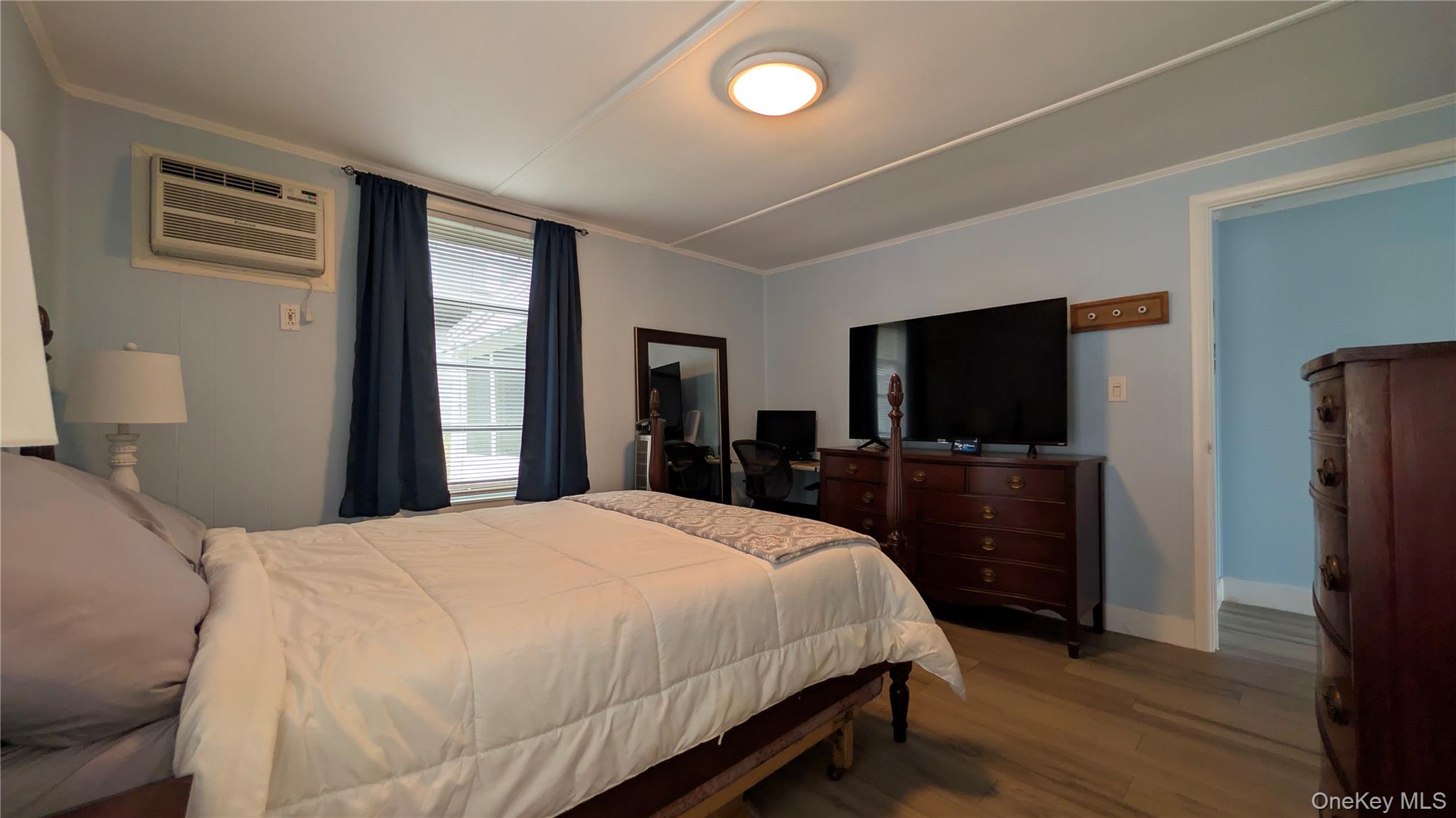 191 Sylvan Lake Road, Unit 28A Hopewell Junction, NY 12533 - Photo 19 of 38 a bedroom with a bed and a flat screen tv
