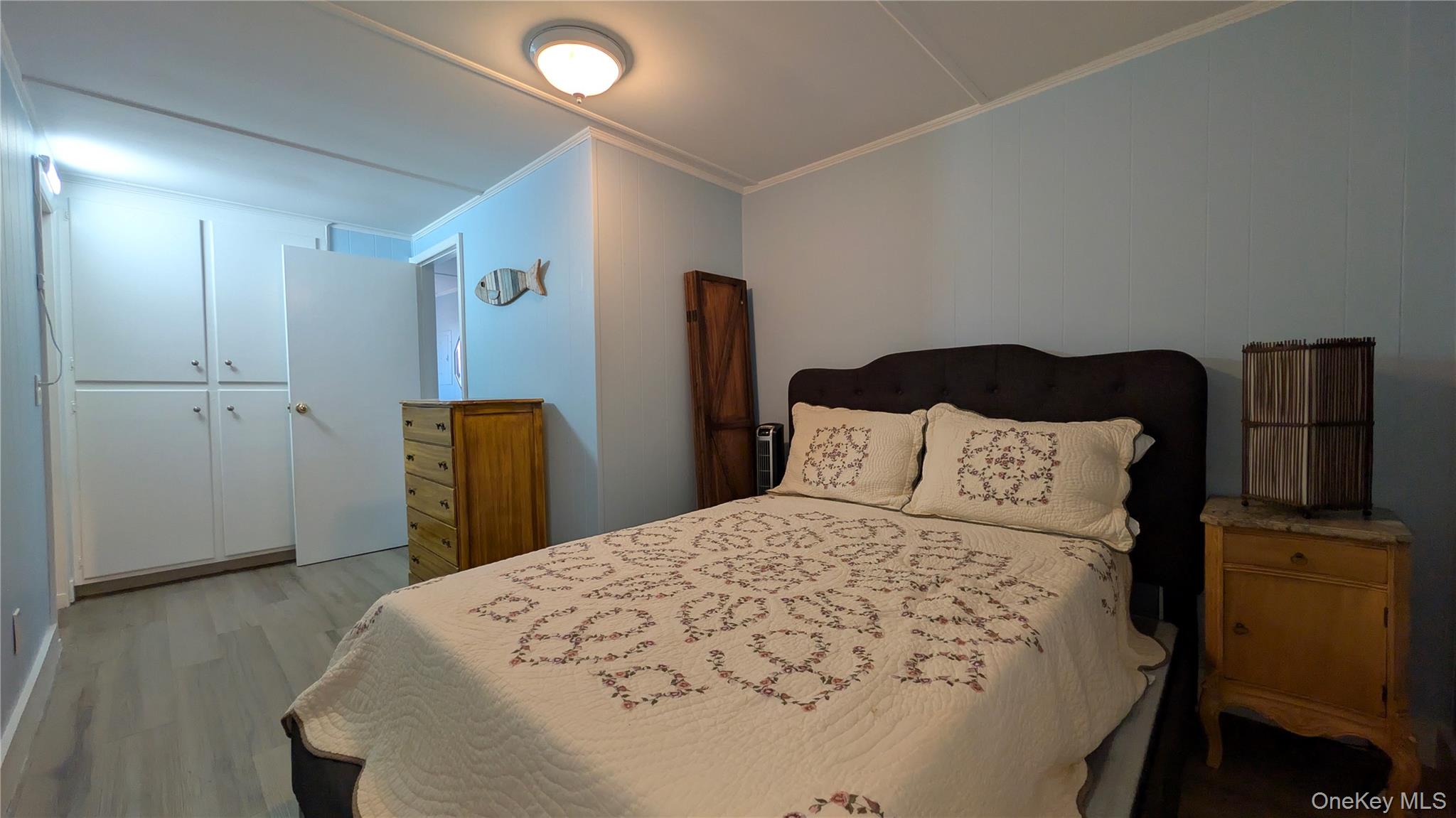 191 Sylvan Lake Road, Unit 28A Hopewell Junction, NY 12533 - Photo 23 of 38 a bedroom with a bed and wooden floor
