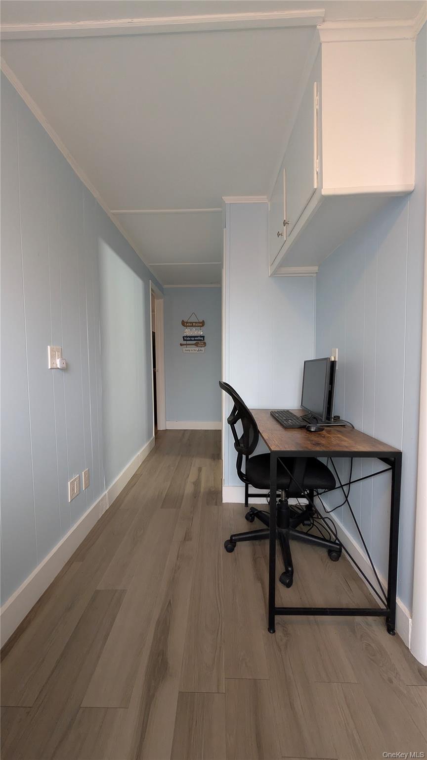 191 Sylvan Lake Road, Unit 28A Hopewell Junction, NY 12533 - Photo 26 of 38 a workspace with furniture and wooden floor