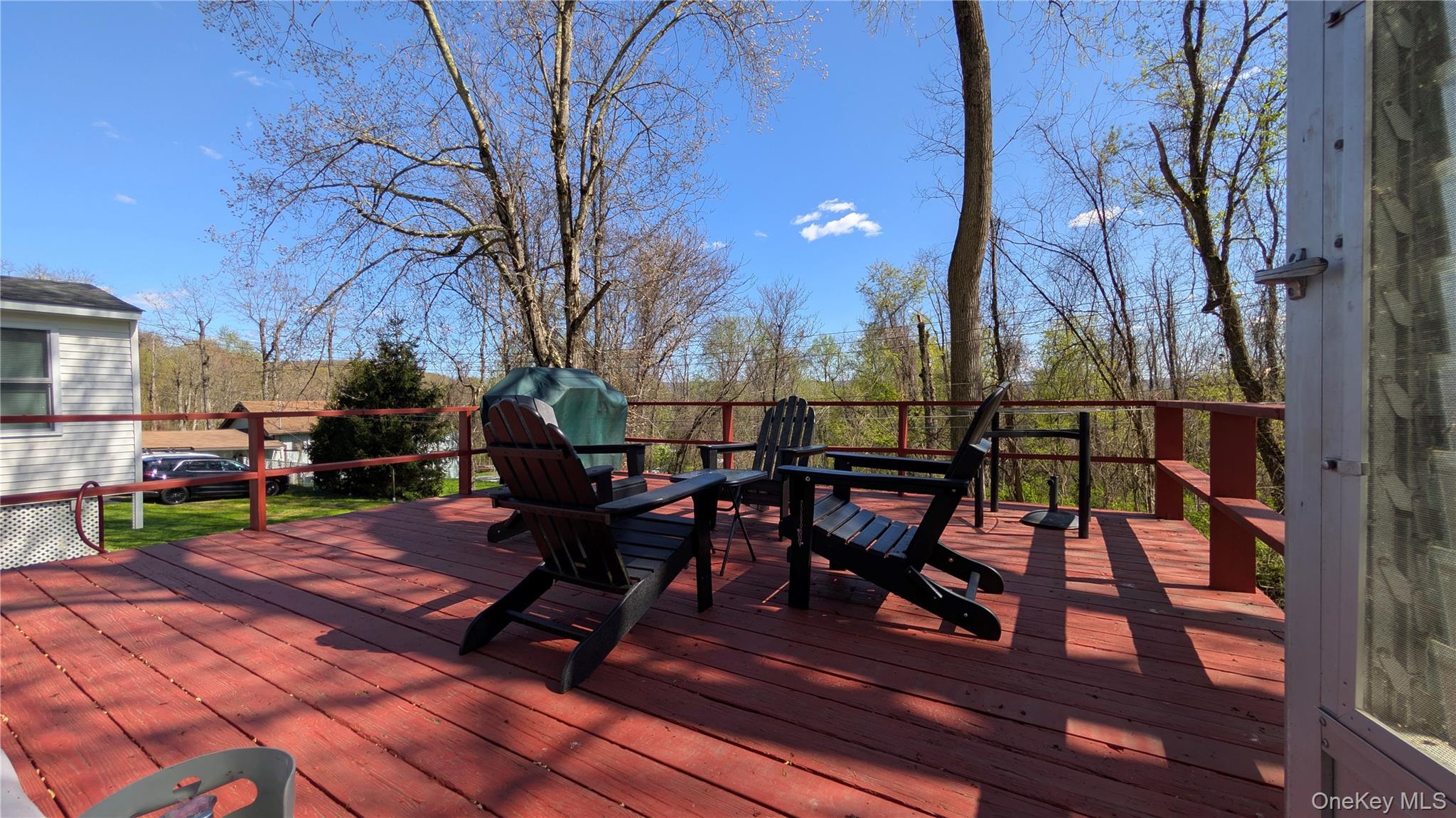 191 Sylvan Lake Road, Unit 28A Hopewell Junction, NY 12533 - Photo 30 of 38 a view of a chairs and tables in the back yard of the house