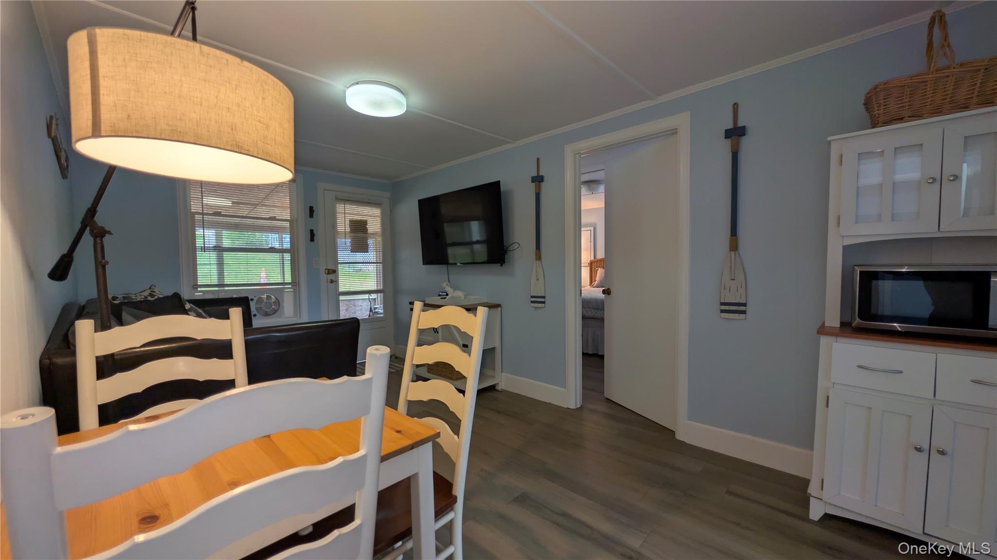 191 Sylvan Lake Road, Unit 28A Hopewell Junction, NY 12533 - Photo 7 of 38 a view of a livingroom with furniture and a flat screen tv