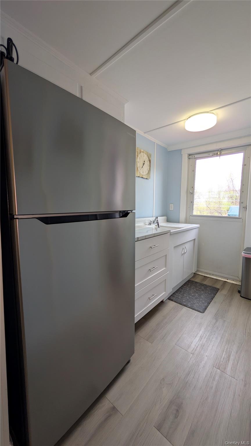 191 Sylvan Lake Road, Unit 28A Hopewell Junction, NY 12533 - Photo 10 of 38 a kitchen with a refrigerator and a sink