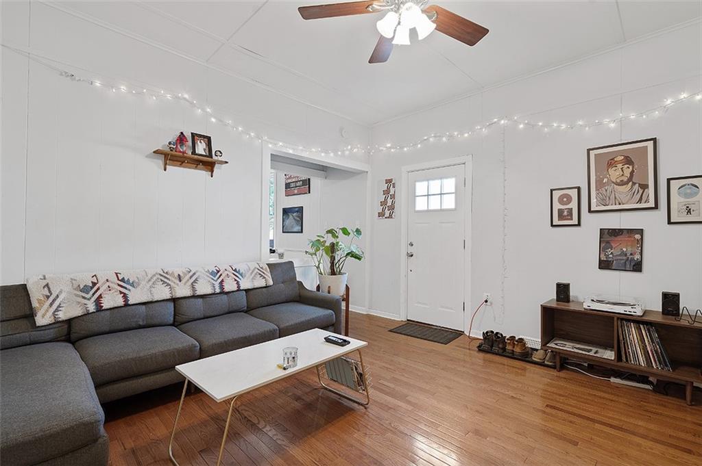 5206 Butler Street Pittsburgh, PA 15201 - Photo 12 of 24 a living room with furniture and wooden floor