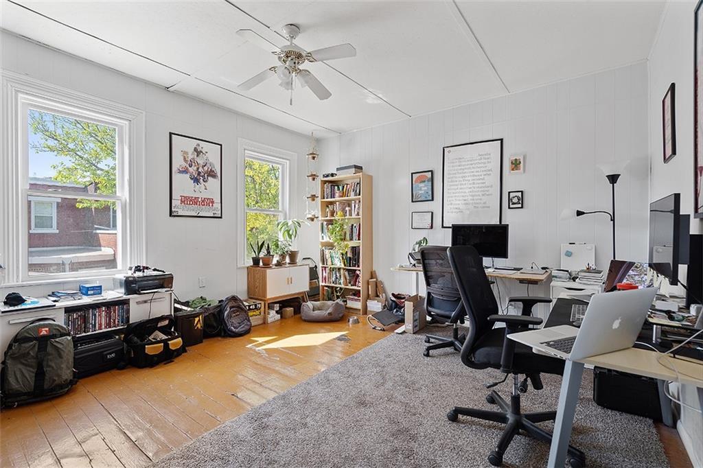 5206 Butler Street Pittsburgh, PA 15201 - Photo 17 of 24 a view of a livingroom with workspace and a window