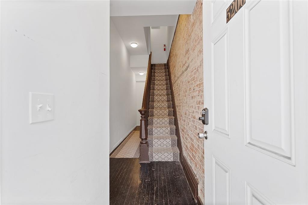 5206 Butler Street Pittsburgh, PA 15201 - Photo 3 of 24 a view of a hallway with wooden floor and staircase