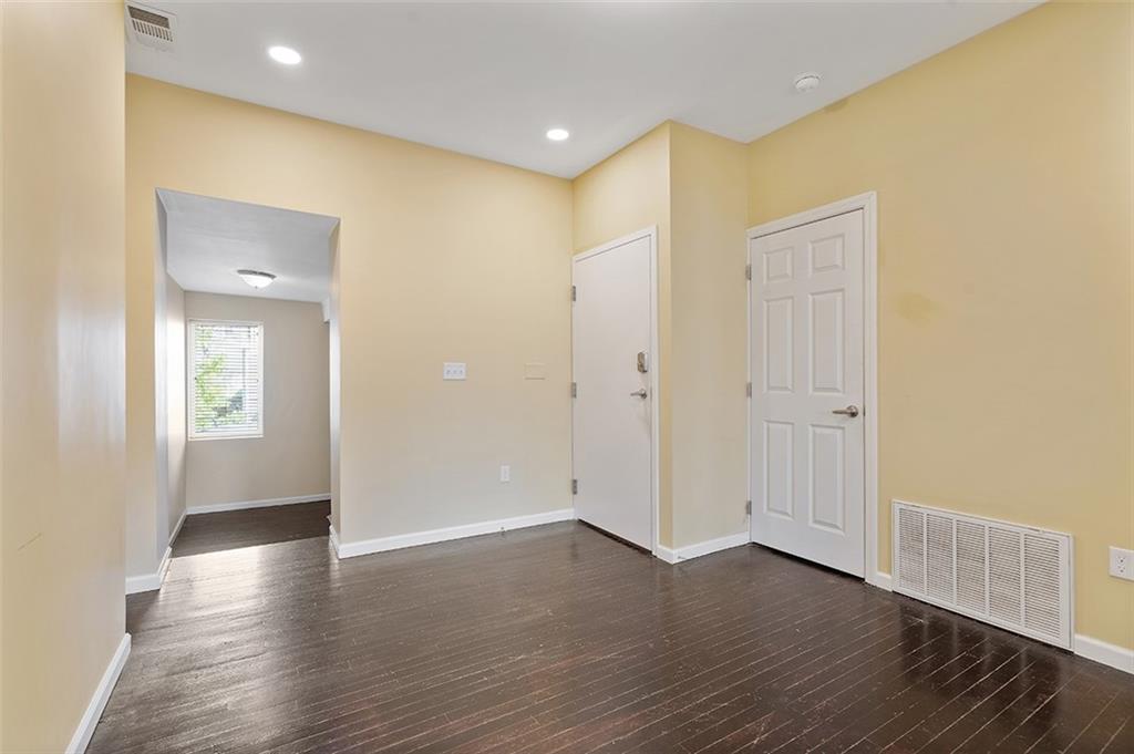 5206 Butler Street Pittsburgh, PA 15201 - Photo 6 of 24 a view of a hallway with wooden floor
