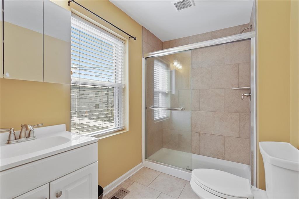 5206 Butler Street Pittsburgh, PA 15201 - Photo 8 of 24 a bathroom with a sink toilet and shower