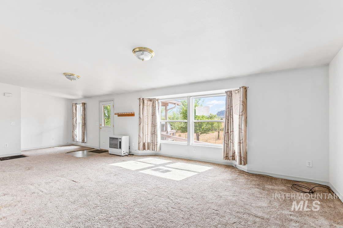 255 3 Bear Creek Road Kendrick, ID 83537 - Photo 13 of 44 Unfurnished living room with carpet flooring