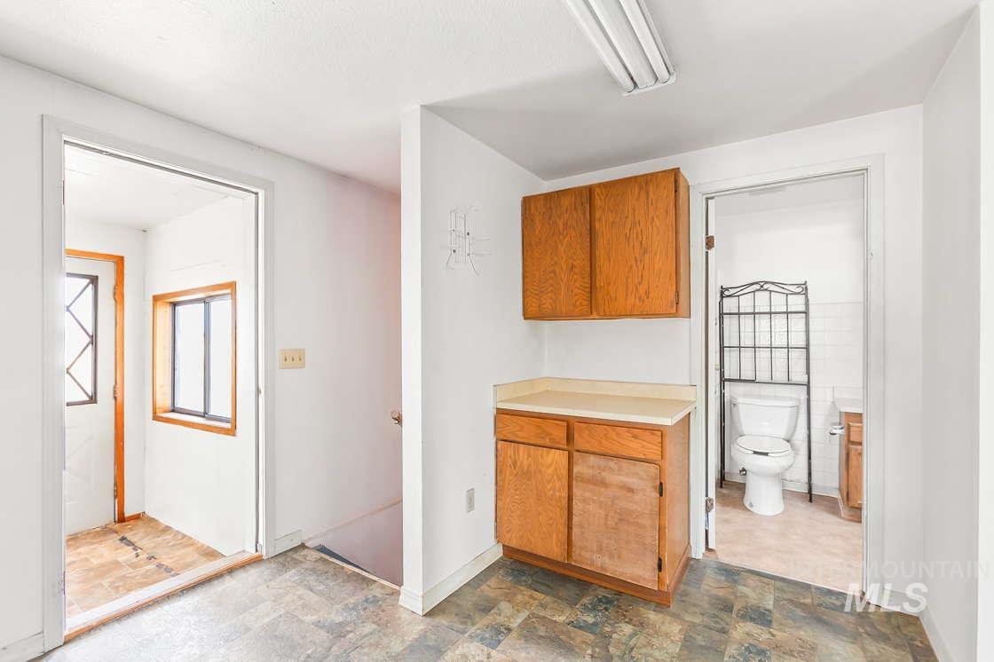 255 3 Bear Creek Road Kendrick, ID 83537 - Photo 18 of 44 Bathroom featuring toilet and stone finish flooring